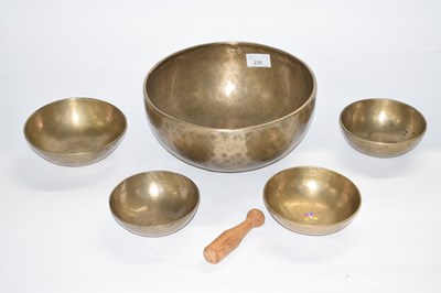 Lot 220 - Five Tibetan singing bowls together with...