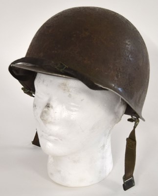 Lot 95 - Second World War American M1 steel helmet with...