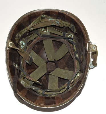 Lot 95 - Second World War American M1 steel helmet with...