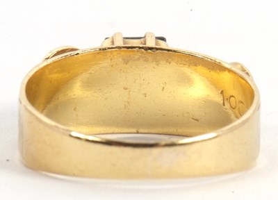 Lot 51 - A sapphire and diamond ring, the central...