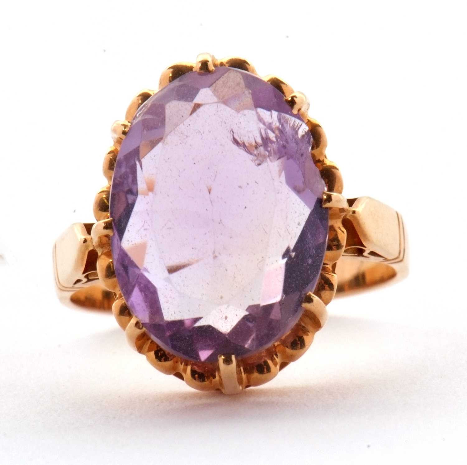 Lot 34 - An amethyst ring, the oval amethyst in a...