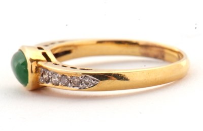 Lot 30 - A jade and diamond ring, the oval collet...