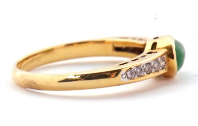 Lot 30 - A jade and diamond ring, the oval collet...
