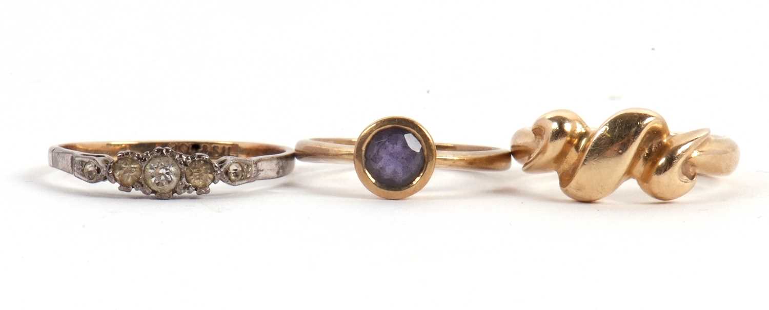 Lot 56 - Three rings: to include a 9ct crossover style...