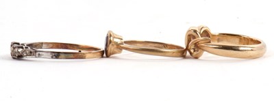 Lot 56 - Three rings: to include a 9ct crossover style...