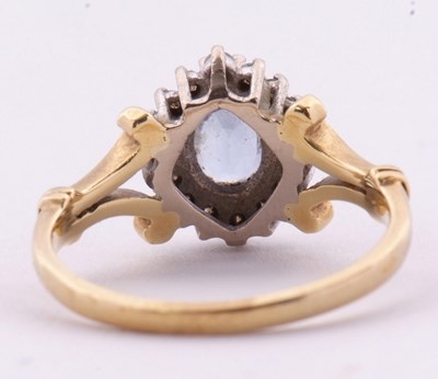 Lot 39 - An 18ct tanzanite and diamond cluster ring,...