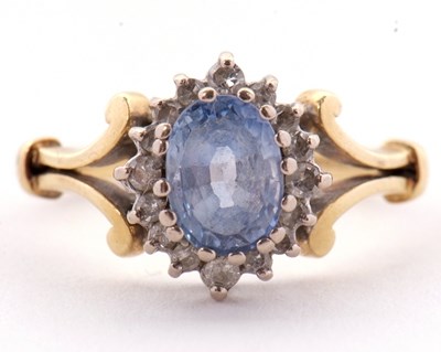 Lot 39 - An 18ct tanzanite and diamond cluster ring,...
