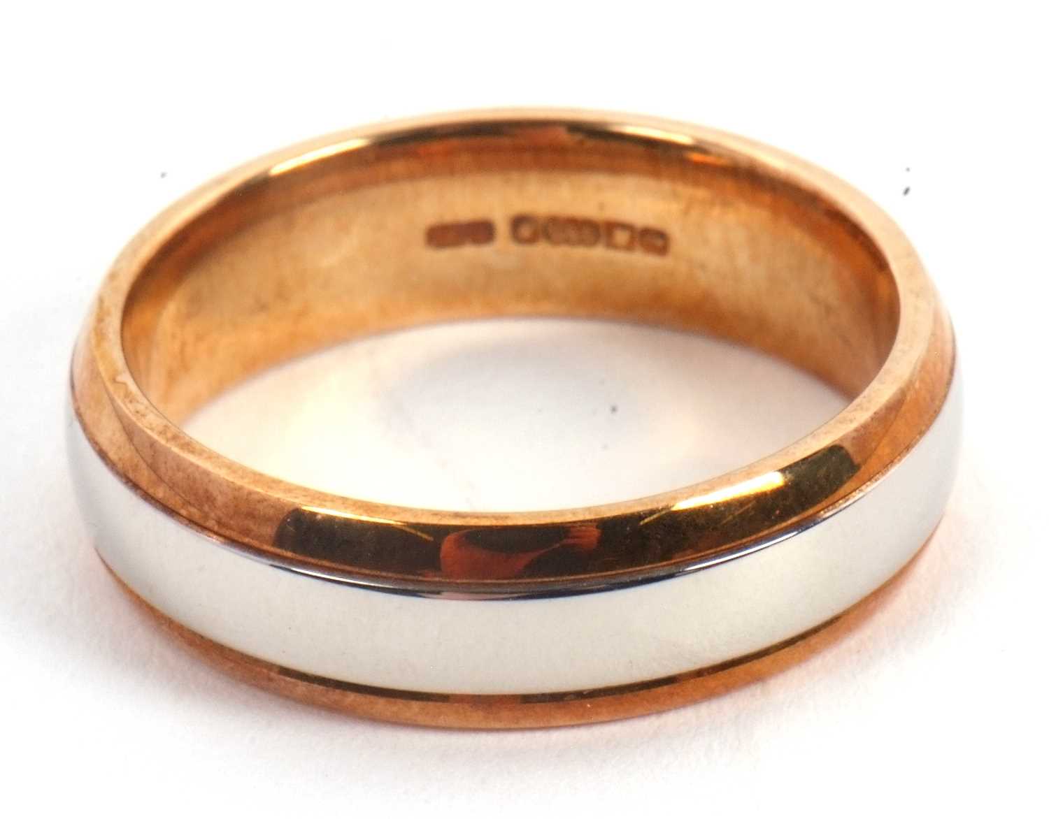 Lot 62 - A 9ct and palladium ring, stamped 375 and 950...