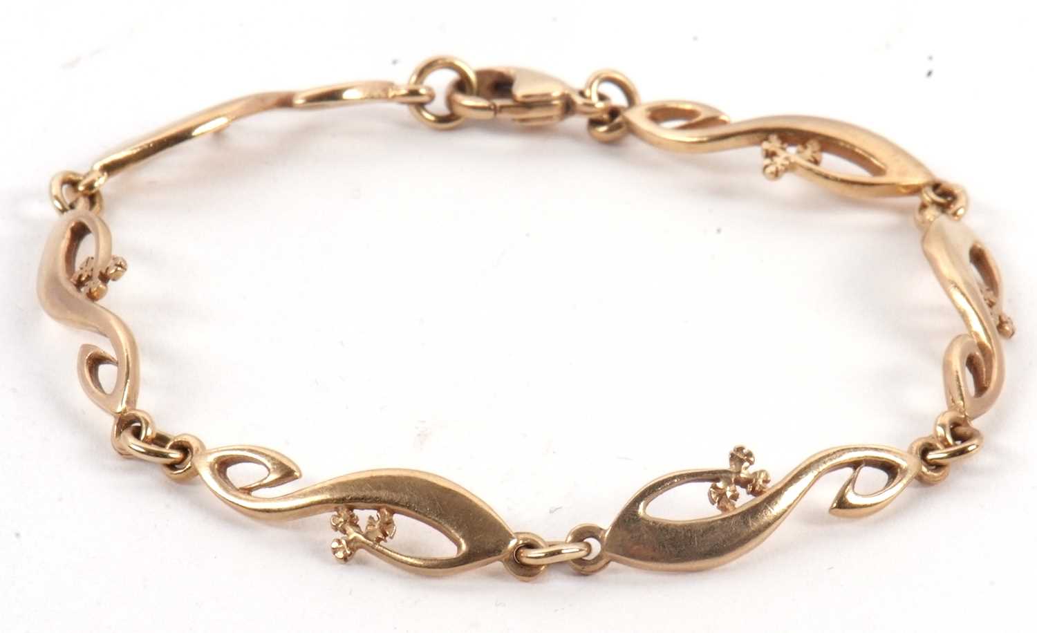 Lot 92 - A 9ct gold bracelet, the fancy link bracelet...