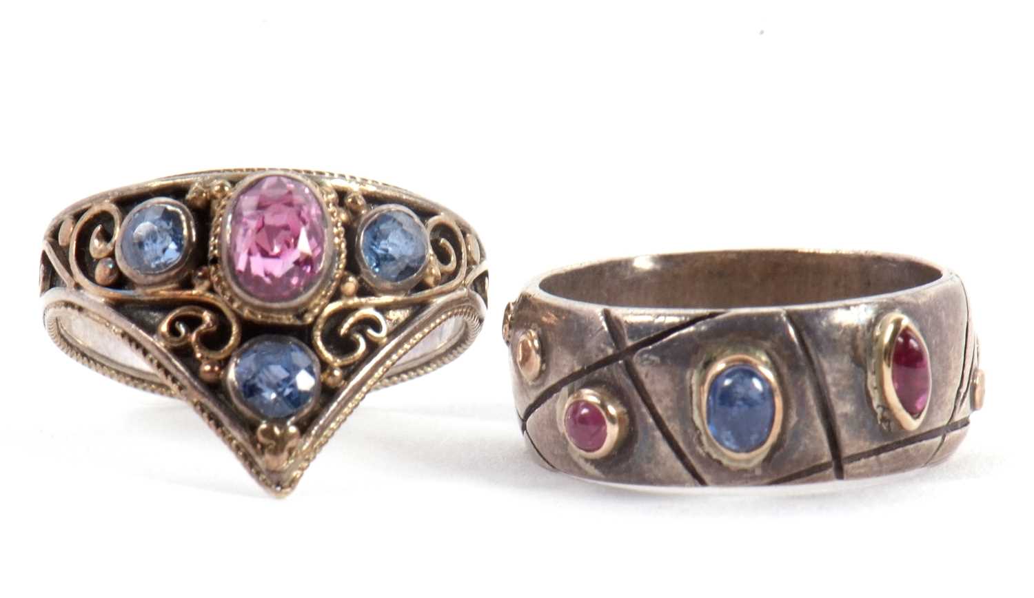 Lot 54 - Two gemset rings: to include a triangular...