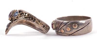 Lot 54 - Two gemset rings: to include a triangular...