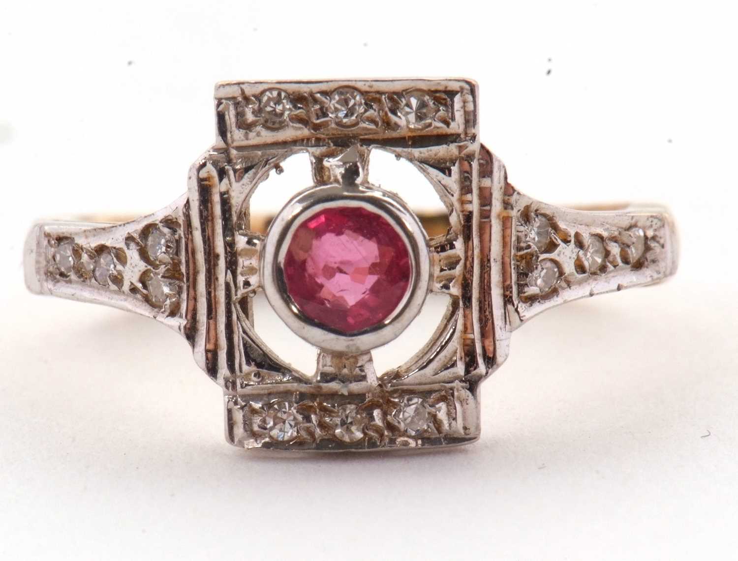 Lot 42 - A 9ct ruby and diamond ring, the central...