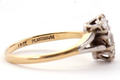Lot 44 - A three stone diamond ring, the three old mine...