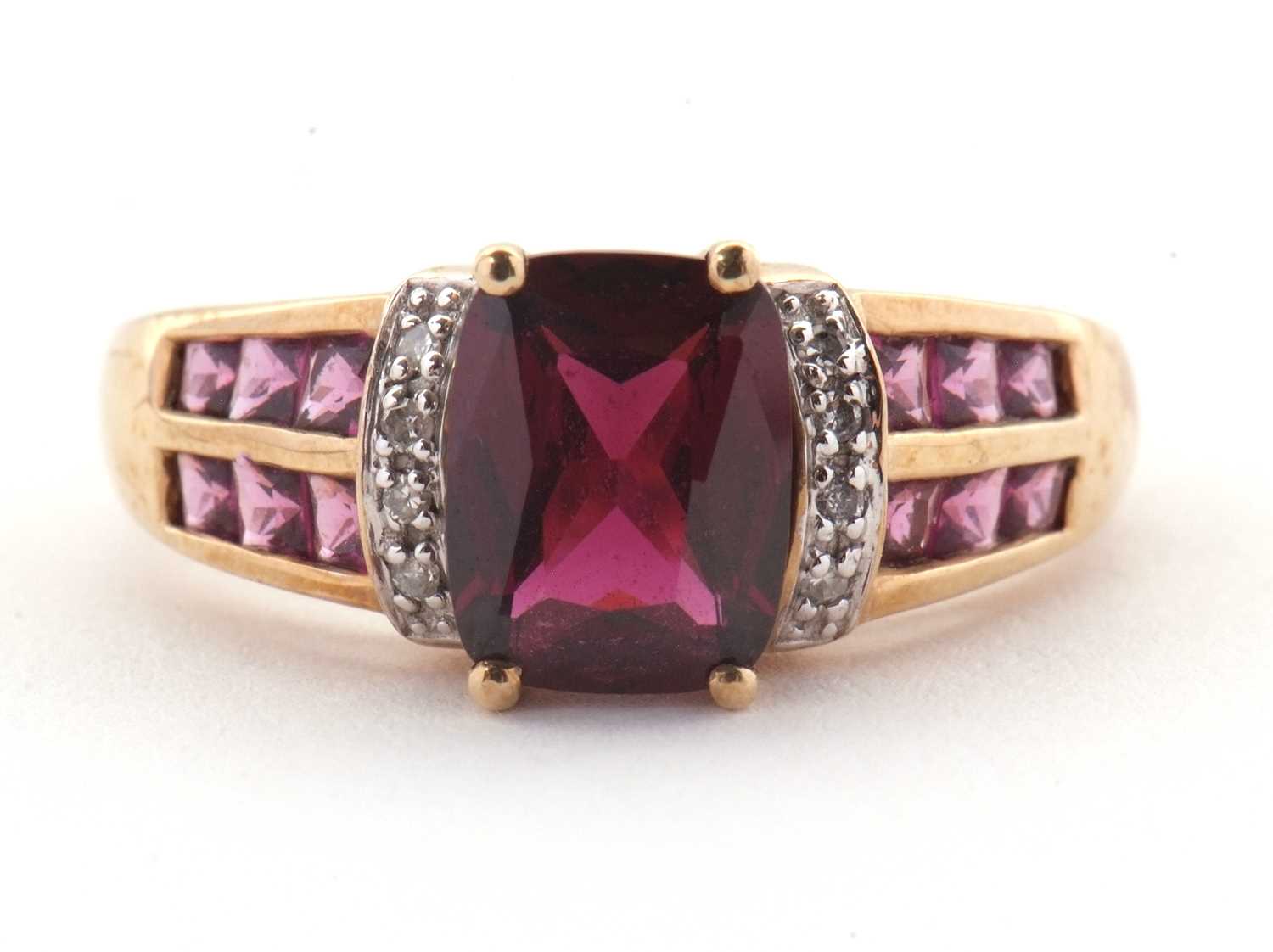 Lot 81 - A 9ct rhodolite garnet and diamond ring, the...