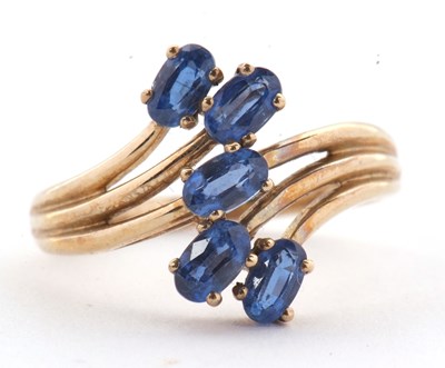 Lot 75 - A 9ct blue stone ring, set with five oval blue...