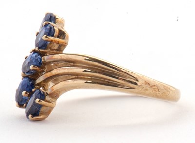 Lot 75 - A 9ct blue stone ring, set with five oval blue...