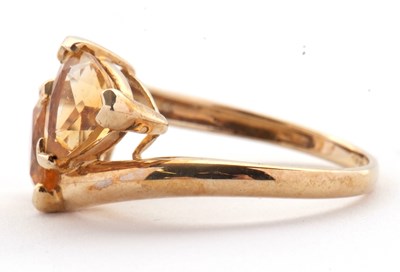 Lot 73 - A 9ct citrine ring, set with two trillion cut...