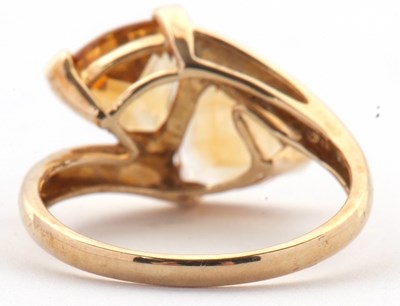 Lot 73 - A 9ct citrine ring, set with two trillion cut...