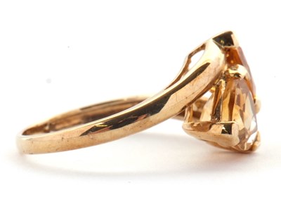 Lot 73 - A 9ct citrine ring, set with two trillion cut...