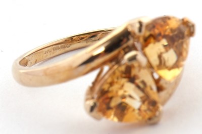 Lot 73 - A 9ct citrine ring, set with two trillion cut...