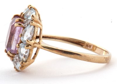Lot 80 - A 9ct amethyst, topaz and diamond ring, the...
