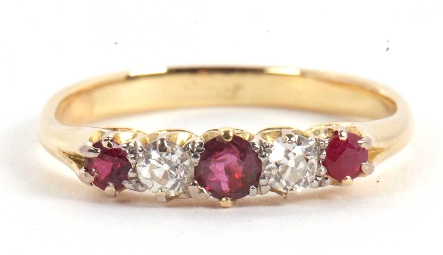 Lot 50 - A ruby and diamond ring, the alternating round...