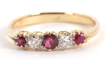 Lot 50 - A ruby and diamond ring, the alternating round...