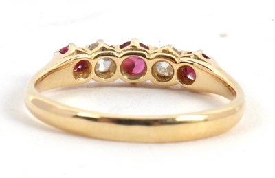 Lot 50 - A ruby and diamond ring, the alternating round...