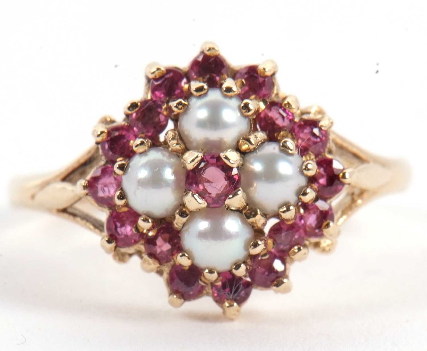 Lot 47 - A 9ct ruby and split pearl ring, the central...
