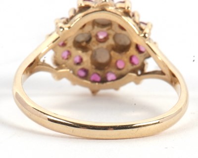 Lot 47 - A 9ct ruby and split pearl ring, the central...
