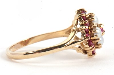 Lot 47 - A 9ct ruby and split pearl ring, the central...