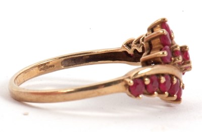 Lot 49 - A 9ct ruby ring, with three crossover style...
