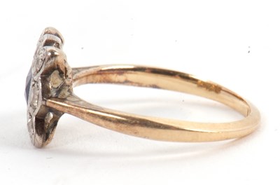Lot 46 - A sapphire and diamond ring, the central...