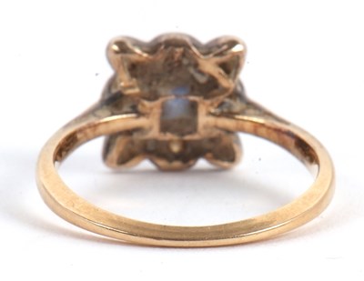 Lot 46 - A sapphire and diamond ring, the central...
