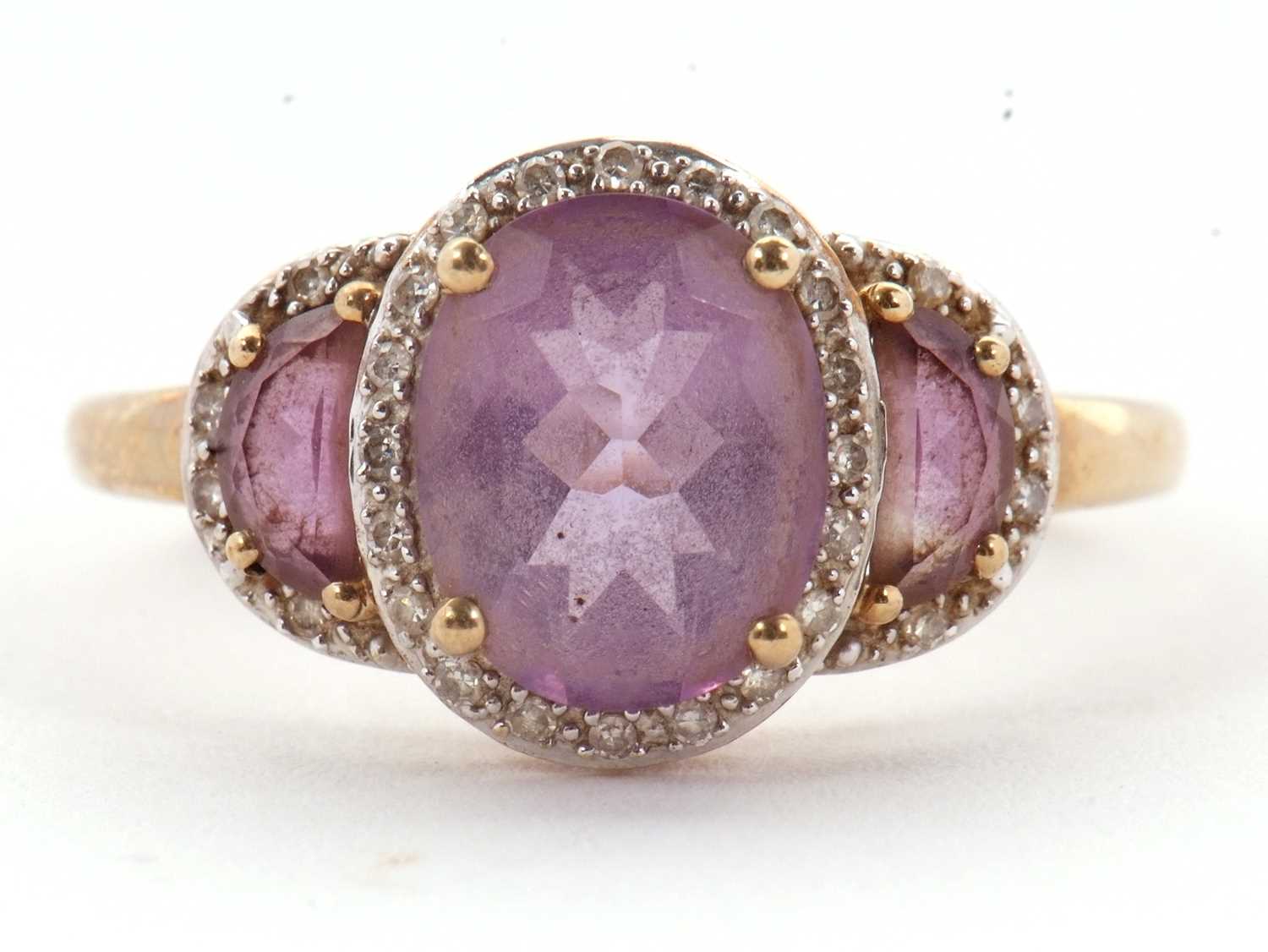 Lot 45 - A 9ct amethyst and diamond ring, the three...