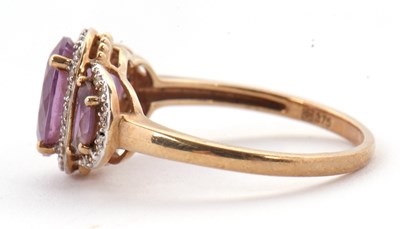 Lot 45 - A 9ct amethyst and diamond ring, the three...
