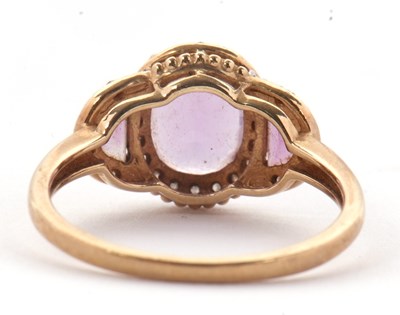 Lot 45 - A 9ct amethyst and diamond ring, the three...