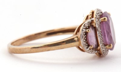 Lot 45 - A 9ct amethyst and diamond ring, the three...