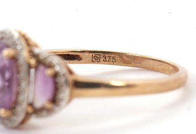 Lot 45 - A 9ct amethyst and diamond ring, the three...