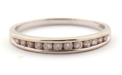 Lot 72 - An 18ct white gold diamond ring, the half hoop...
