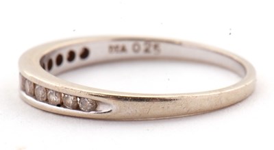 Lot 72 - An 18ct white gold diamond ring, the half hoop...