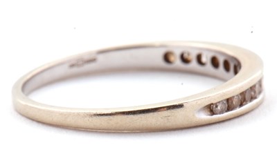Lot 72 - An 18ct white gold diamond ring, the half hoop...