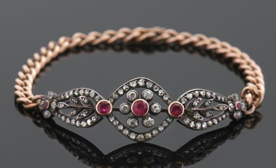Lot 285 - A ruby and diamond bracelet, the centre...