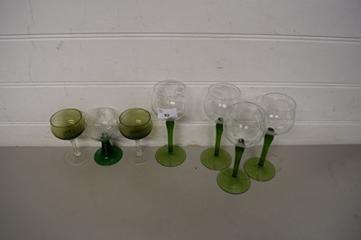 Lot 82 - FOUR GREEN STEMMED HOCK GLASSES AND THREE OTHERS