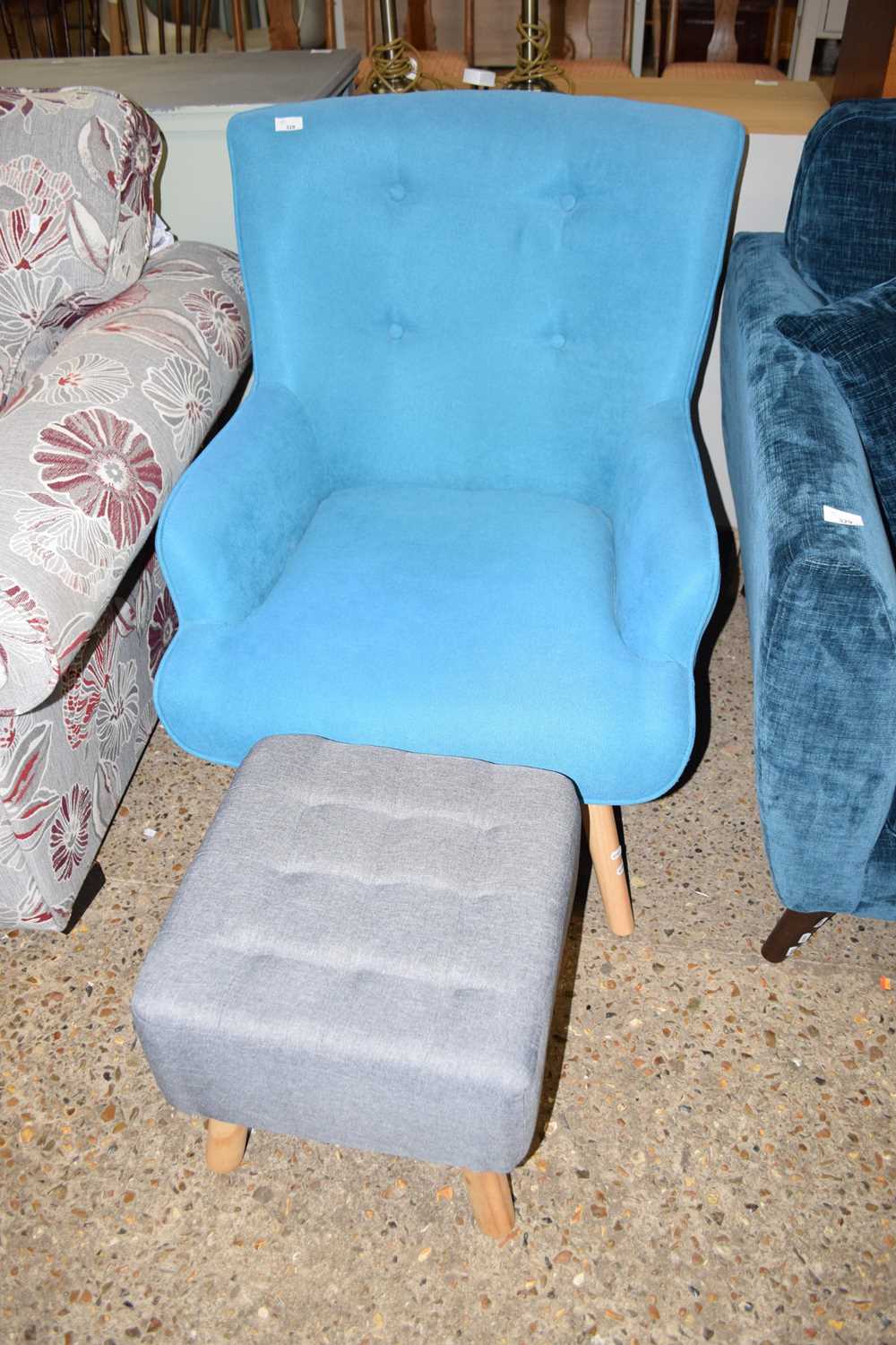 Lot 328 - A modern turquoise armchair and a footstool