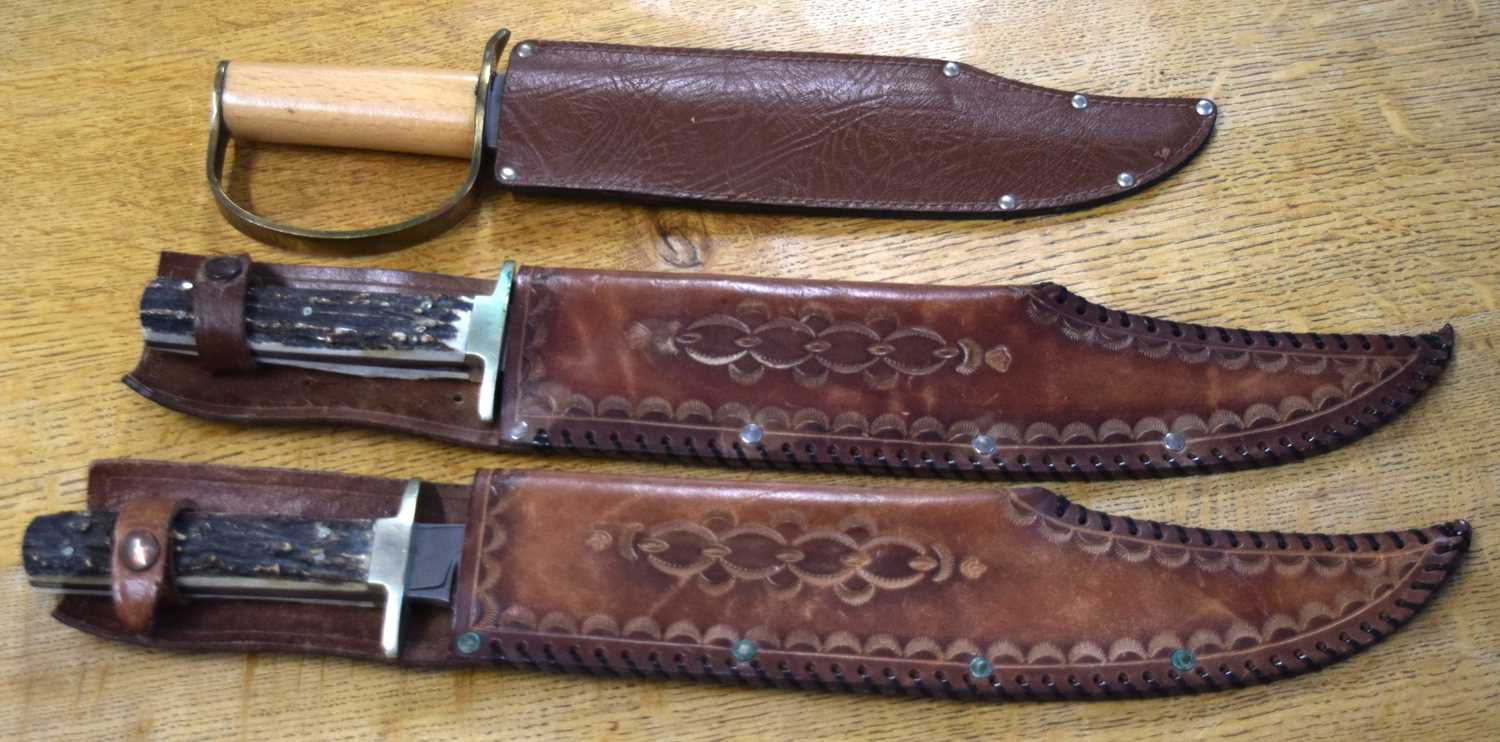 Lot 119 - three very large modern bowie knifes with...