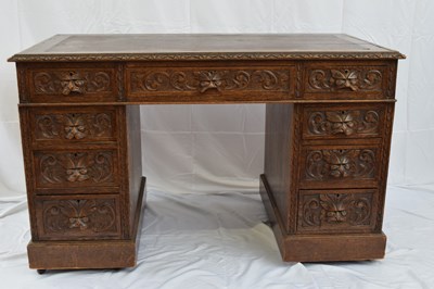Lot 209 - Victorian Gothic carved oak twin pedestal desk...