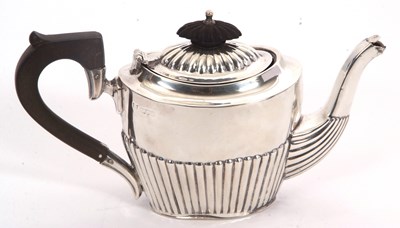 Lot 22 - An Edwardian silver bachelor teapot of oval...