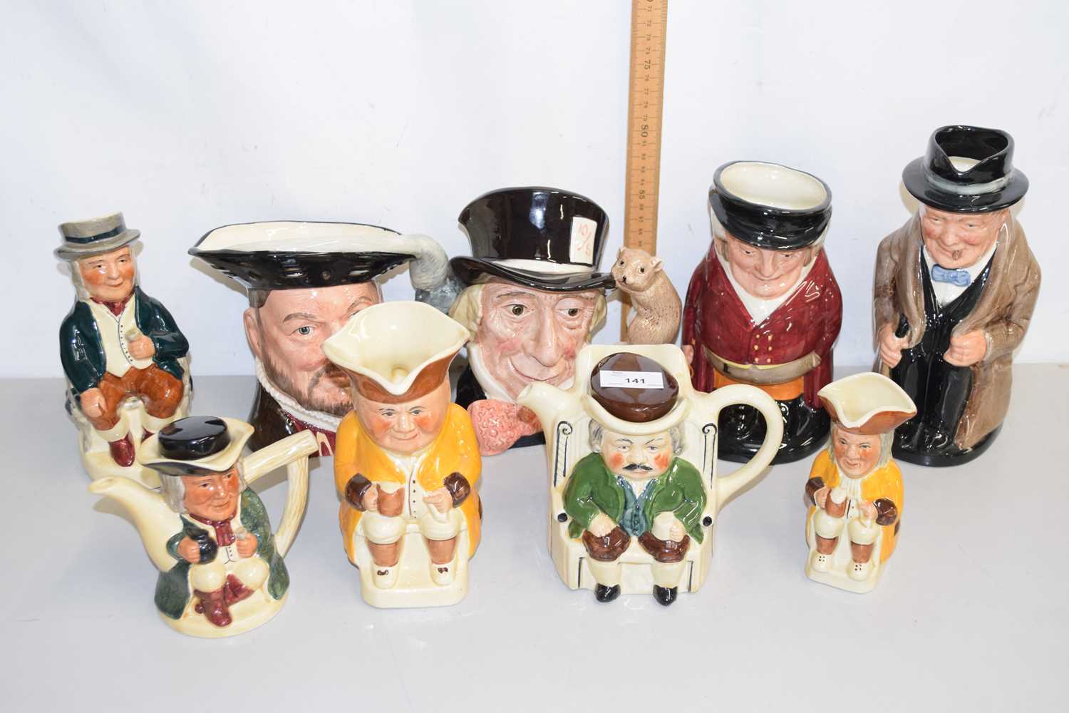 Lot 141 - Collection of various character jugs to
