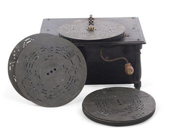 Lot 311 - An English music box and metal discs, 35cm long